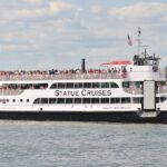 Statue Cruises ferry boat full of passengers in New York Harbor
