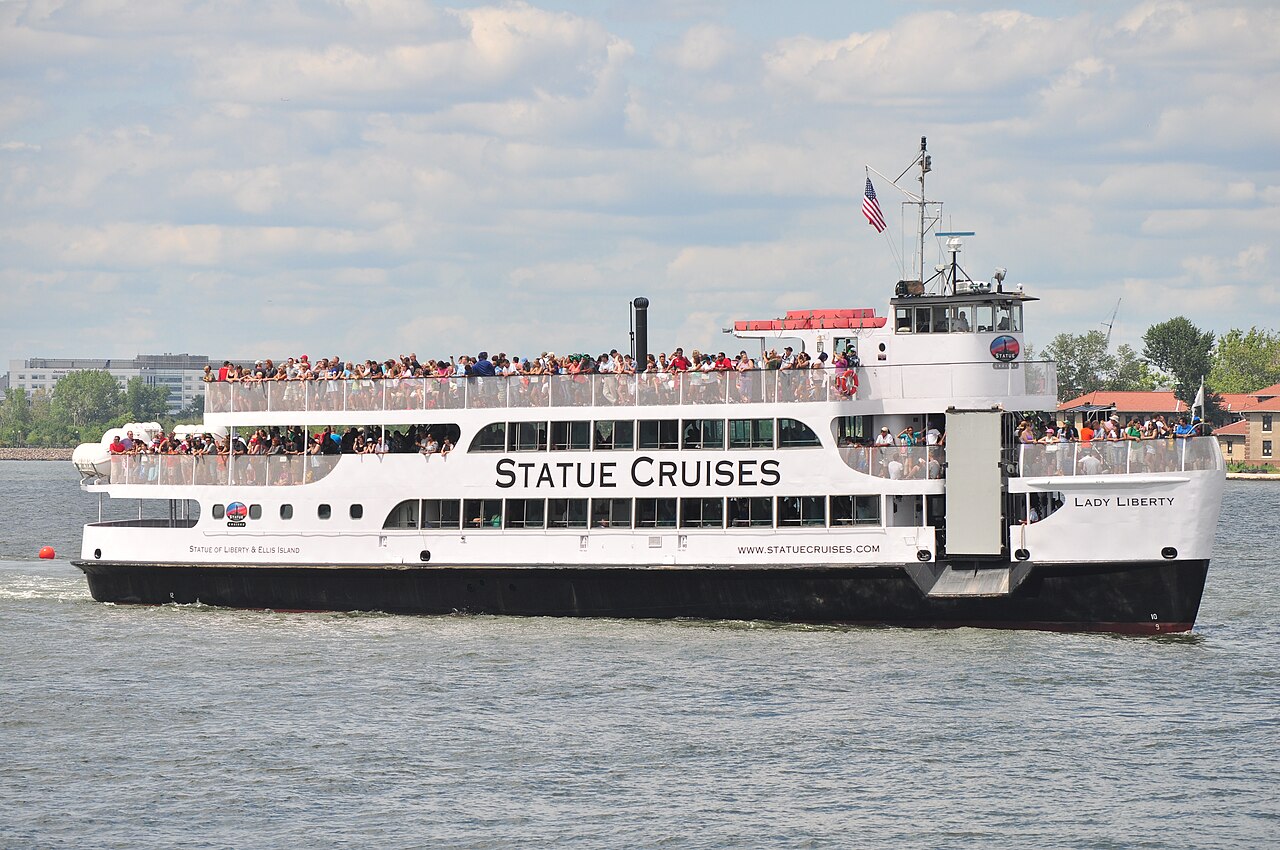 Statue Cruises ferry boat full of passengers in New York Harbor