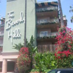 The Beverly Hills Hotel pink facade with palm trees